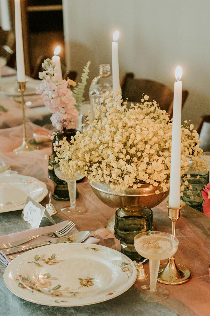 an-elegant-wedding-table-setting-with-floral-decor-and-candlelight-perfect-for-a-romantic-celebration-E3vFwNSBpBv_51fdwlN33w